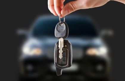 car key fob with car in background